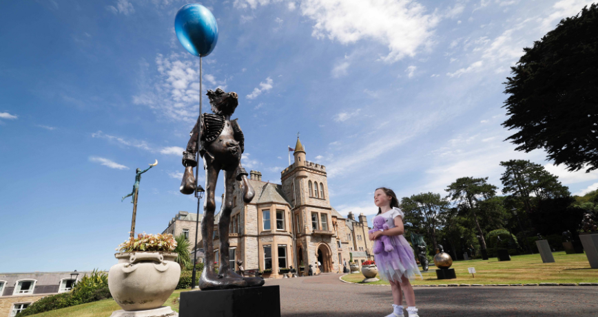 Lucy Gormley, 4, pictured with Patrick O’Reilly’s sculpture Holding Dreams at Culloden Estate and Spa, Cultra